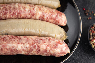 raw sausages pork, beef, chicken, lamb fresh tasty food dish delicious gourmet food background on the table rustic food top view copy space