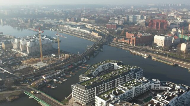 New Apartments and Urban Construction by the river, Hazy Morning Light. Szczecin Poland.