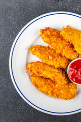Chicken nuggets in breaded deep fried fresh tasty food dish delicious gourmet food background on the table rustic food top view copy space