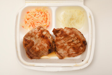 Roast pork loin with salad. Delicious meat breakfast.