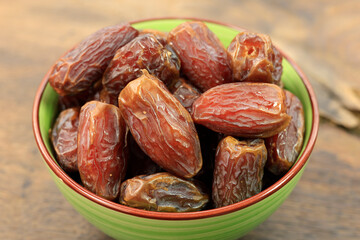 dried dates on a rustic wooden table