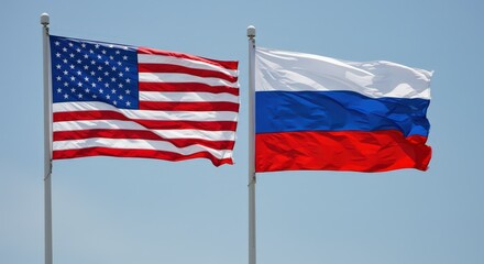 Obraz premium Flags of america and russia flutter in the wind. International relations between united states and russian federation. USA and russia friendship concept