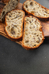 Grain bread sunflower, chia, flax seed, cut oats fresh tasty food dish delicious gourmet food background on the table rustic food top view copy space vegetarian and vegan food