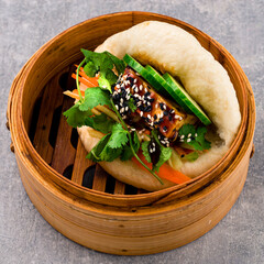 Vegan bao from Asian restaurant bun with fried tofu