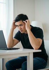 Man Stressed at Laptop, Home Office