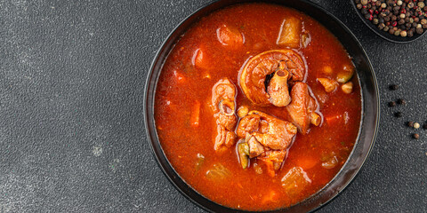 Tomato meat soup vegetable goulash fresh tasty food dish delicious gourmet food background on the table rustic food top view copy space keto and paleo diet
