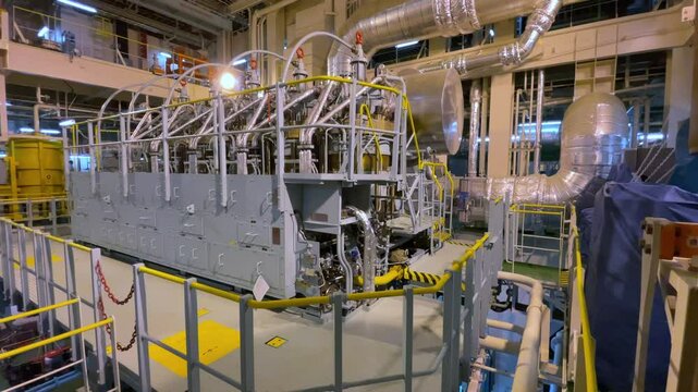 Large marine diesel in engine room of ship