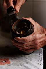 Preparing Ground Coffee in a Grinder