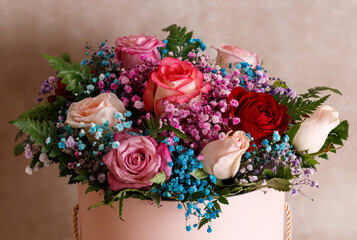 Luxurious bouquet in a round pink box. Gift card