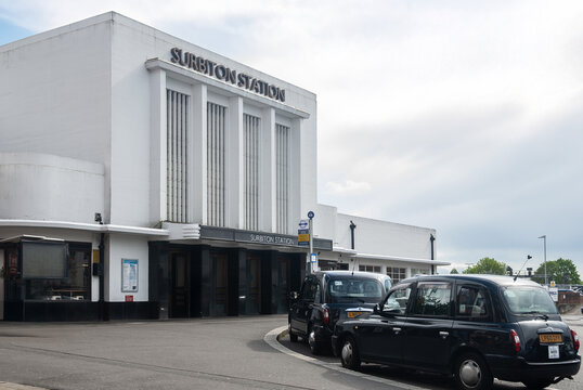 Art deco style, Surbiton station, London, direct link to centrum of London. Black cab waiting for passengers.