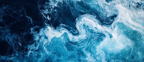Energetic dance of blue and white waves captures the ocean's untamed and captivating essence, a tapestry of swirling colors and textures.