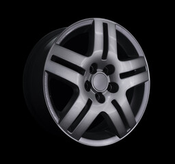 Car alloy wheel isolated on black background