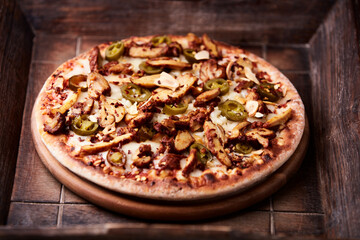 Gyros Pizza with jalapeno pepper, cherry tomatoes and mozzarella cheese. Soft focus. Close up.	