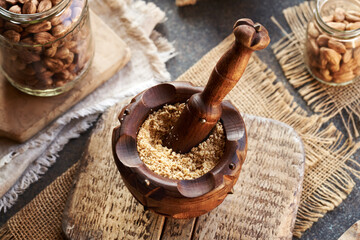 Preparation of homemade hazelnut butter in a wooden mortar