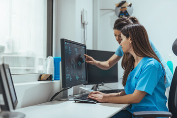 Medical Professionals Analyzing Diagnostic Images on Computer in Modern Clinical Setting