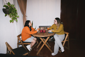 UGC. Personal file photo. Retro style photo taken by real people, meeting of two women chatting and having cocktails