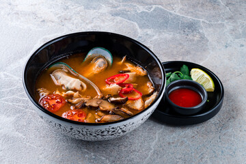 Thai dish tom yam. Traditional spicy soup close-up