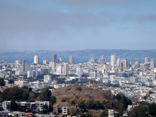 View of San Francisco skyline featuring urban landscape and distant hills under a clear sky