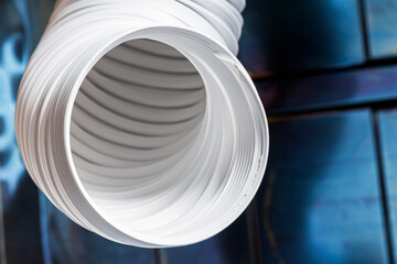 Flexible air duct ventilation hose in an industrial space