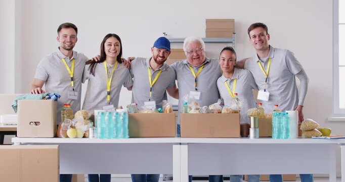 Volunteer diverse team together, young, senior people gathering in common team organization for food bank project, community supporting, group teambuilding together to help, guide and offer assistance