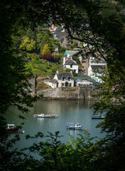 house on the river with boats