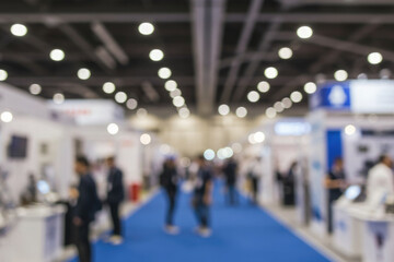 Fototapeta premium Blurred motion of people at a global business trade show.