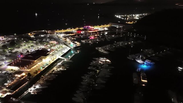 Cinematic aerial view from a drone at night on the Amador Causeway in Panama City, 4K Video