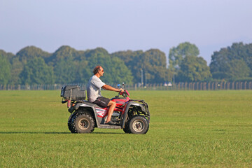 Fototapeta premium Man riding a quad bike 