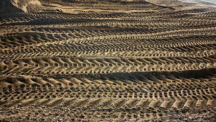 Tire tracks on dirt sand road