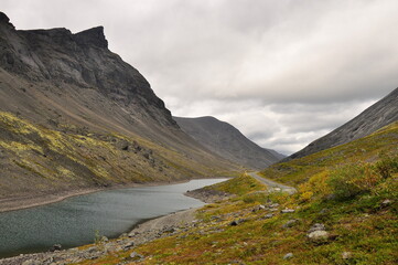Lake in the valley between the mountains. Khibiny, Kirovsk, Russia, north.