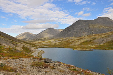 Lake in the valley between the mountains. Khibiny, Kirovsk, Russia, north.
