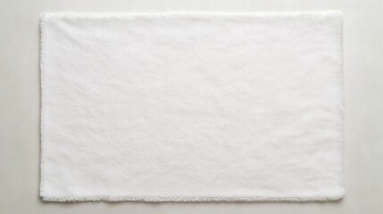 White fuzzy rug on white surface