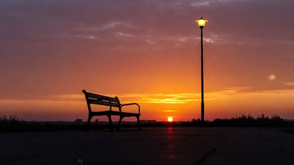 Empty park bench at sunset, peaceful scene