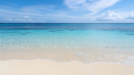 Fototapeta premium A serene beach scene featuring crystal-clear blue water gently lapping at the shore, a sunny sky with fluffy white clouds, vibrant yet calming colors. travel brochures or summer product branding.