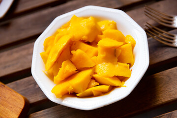 Juicy pieces of diced mango fruit served on platter
