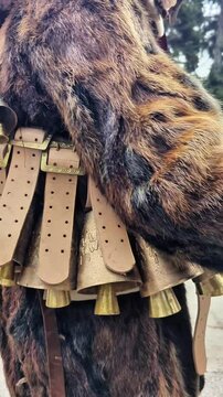 Kukeri costumes and masks with bells in the clothing, dedicated to the annual Kukeri folklore festival in Bulgaria