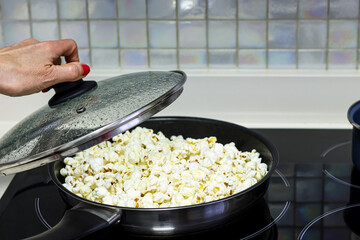 Making popcorn in a pan.
