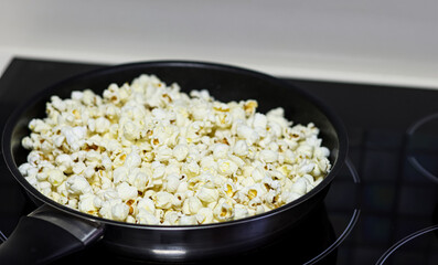 Making popcorn in a pan.