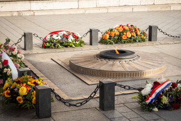 The flame of the unknown soldier under the arches of the Arc de Triomphe in Paris - 3