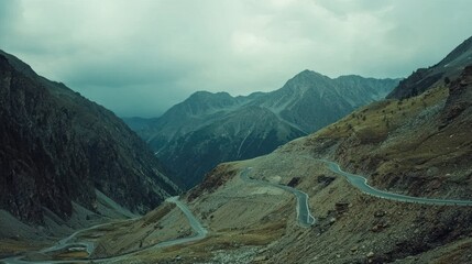 Winding mountain road through a valley.