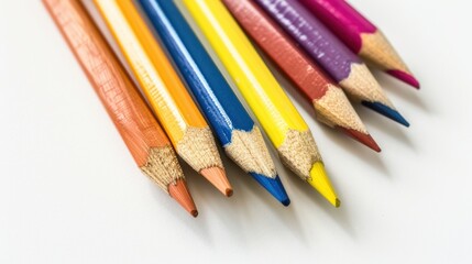 Fototapeta premium Randomly colored pencils lying on a white background.