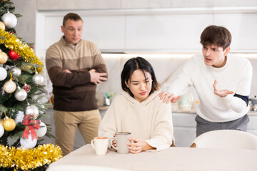 Domestic quarrel during Christmas celebration - relatives scold a young girl