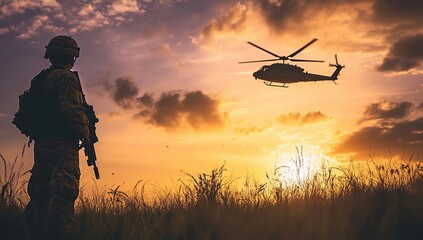 Silhouette of a Soldier Watching a Helicopter at Sunset