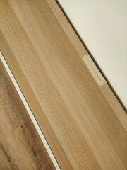 Cable duct concealed under wooden desk in modern office, prague