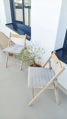 Two folding chairs with cushions on modern balcony in prague