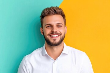 Fototapeta premium Handsome man showing his best smile in pastel light