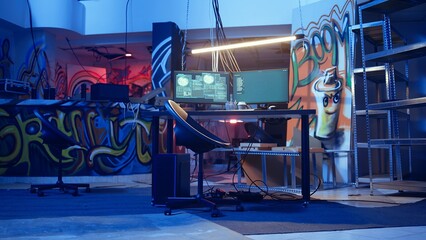 High tech computer system running malicious code in empty basement, handheld camera shot. PC...