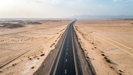 Desert Highway Top View: Aerial Shot of Empty Straight Road in Arid Landscape