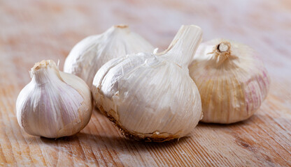 Image of fresh garlic on wooden surface, nobody