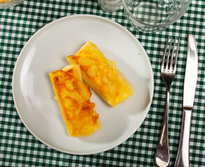 Delicious pancakes stuffed with meat served on platter for breakfast